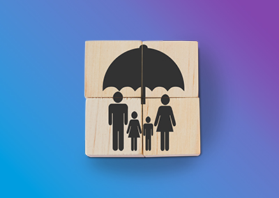 Four wooden blocks with a picture of a family standing under an umbrella.